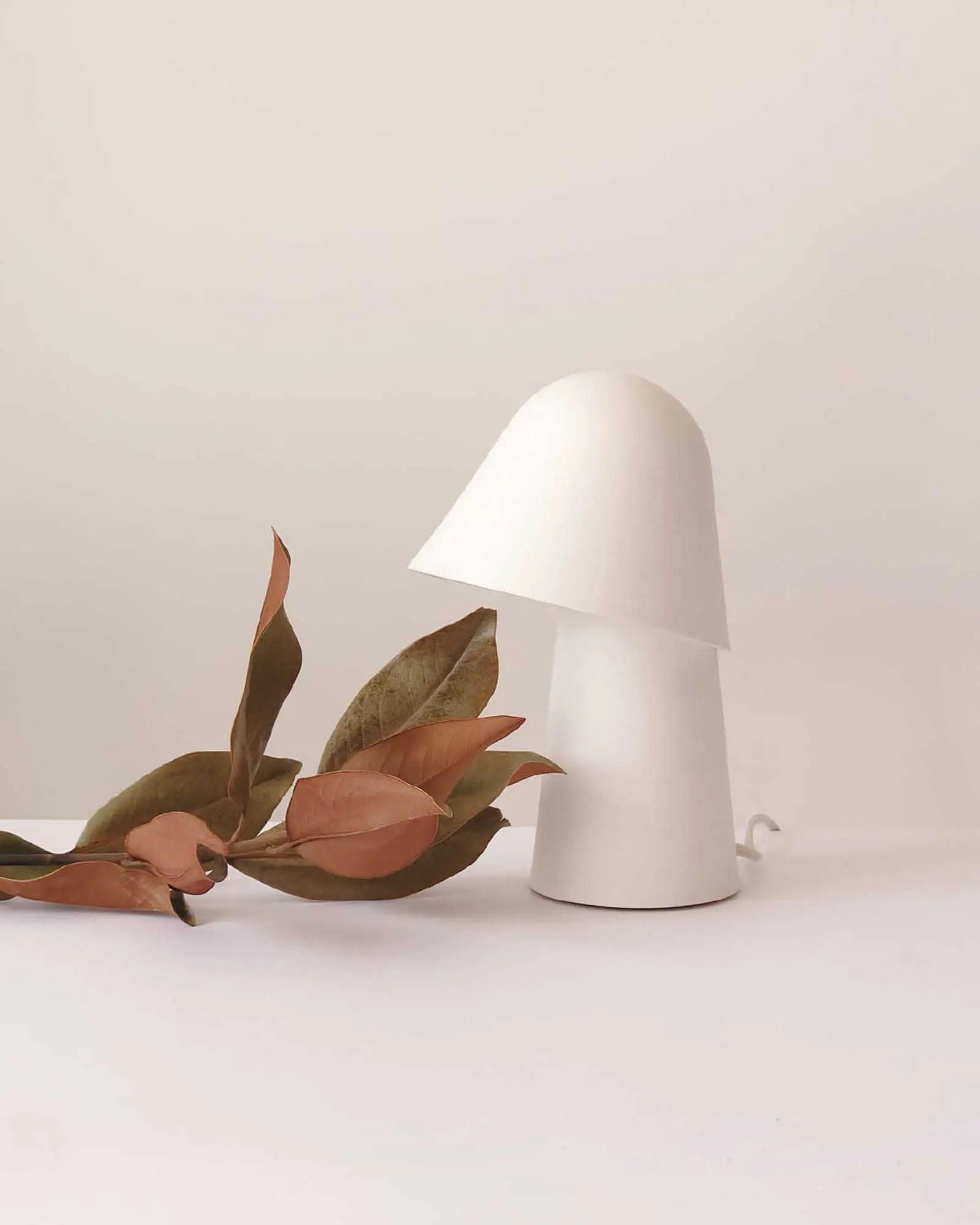 Okina Terracotta table lamp on a table